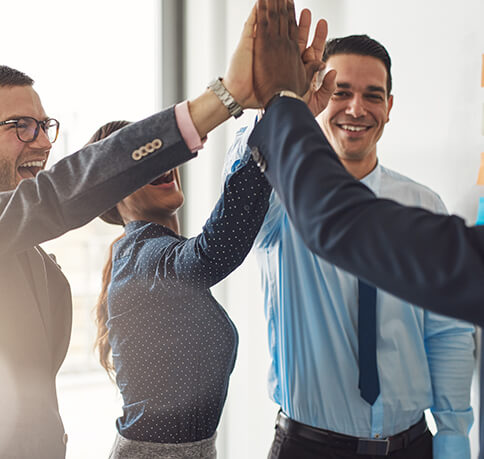 team members high fiving